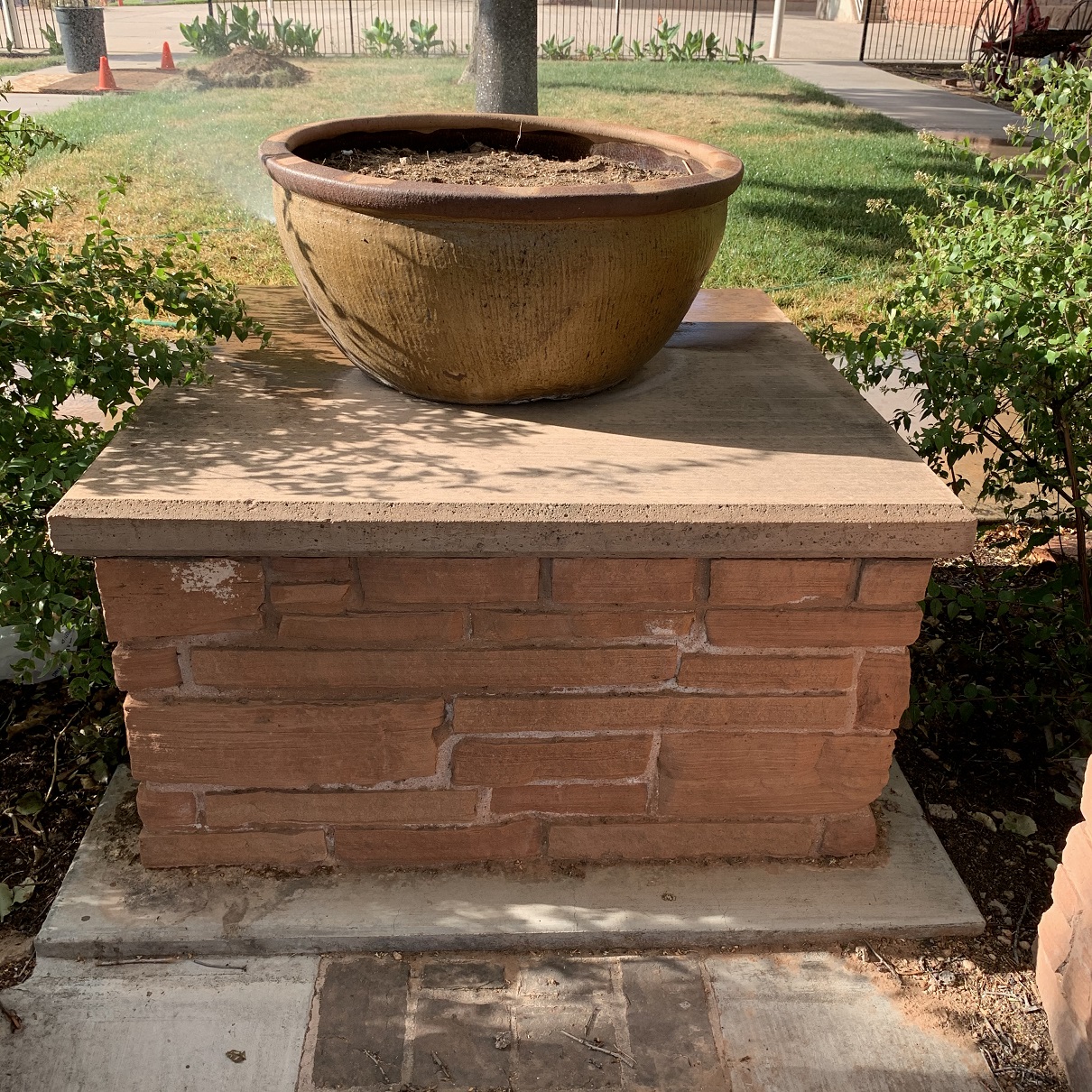 Pedestal with a pot on top at the Monument Plaza in Washington, Utah