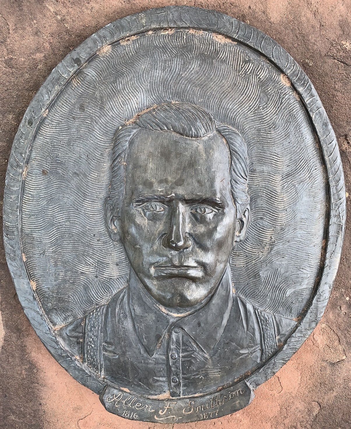 Face plaque of Allen F. Smithson at the Monument Plaza in Washington, Utah