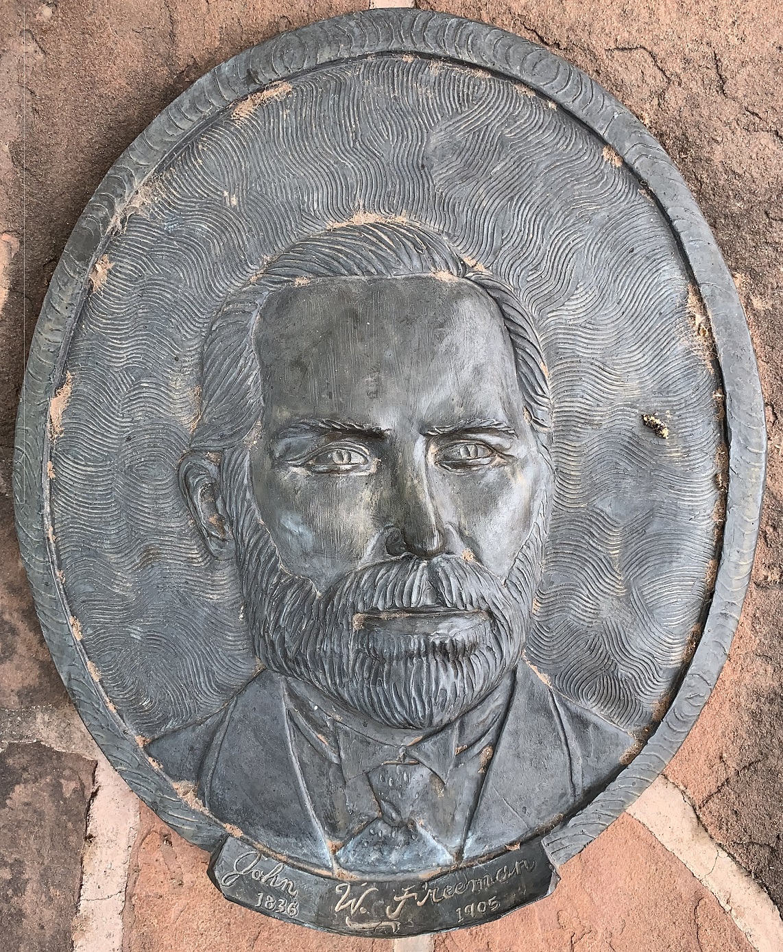 Face plaque of John W. Freeman at the Monument Plaza in Washington, Utah