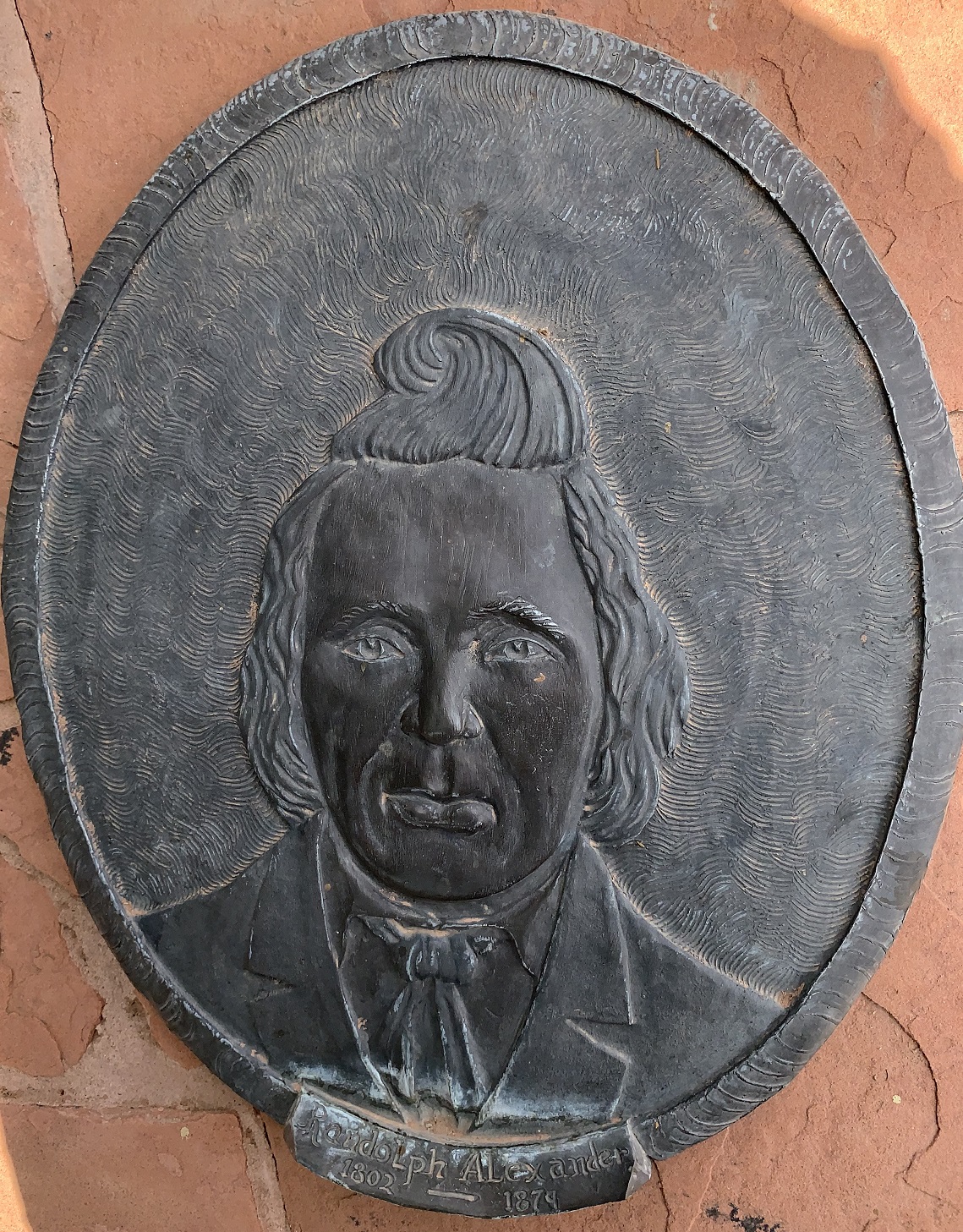 Face plaque of Randolph Alexander at the Monument Plaza in Washington, Utah