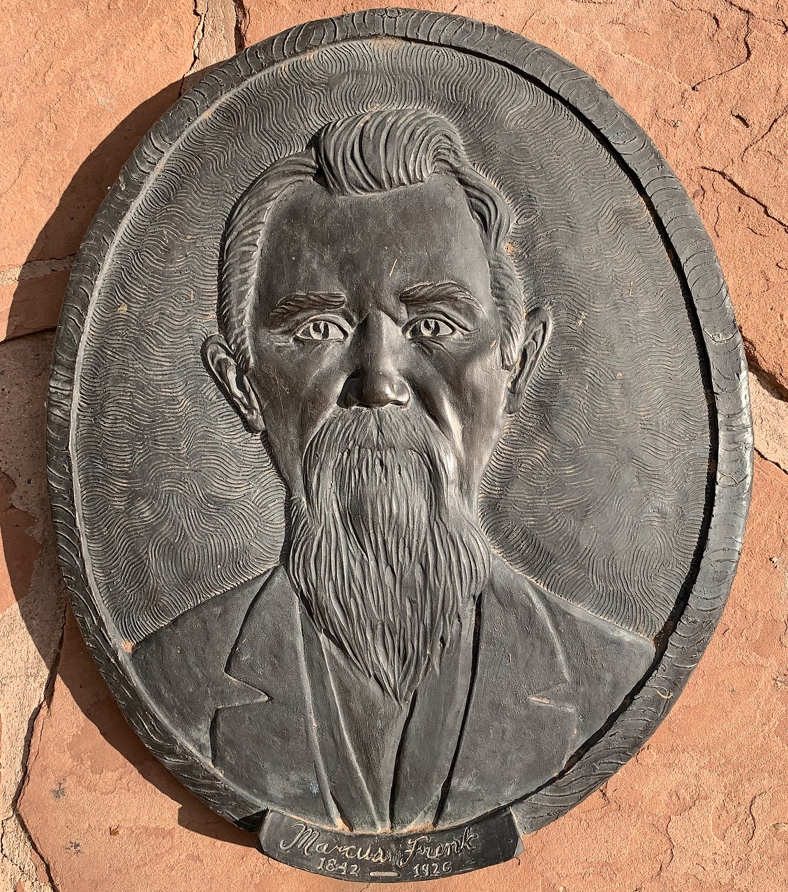 Face plaque of Marcus Funk at the Monument Plaza in Washington, Utah