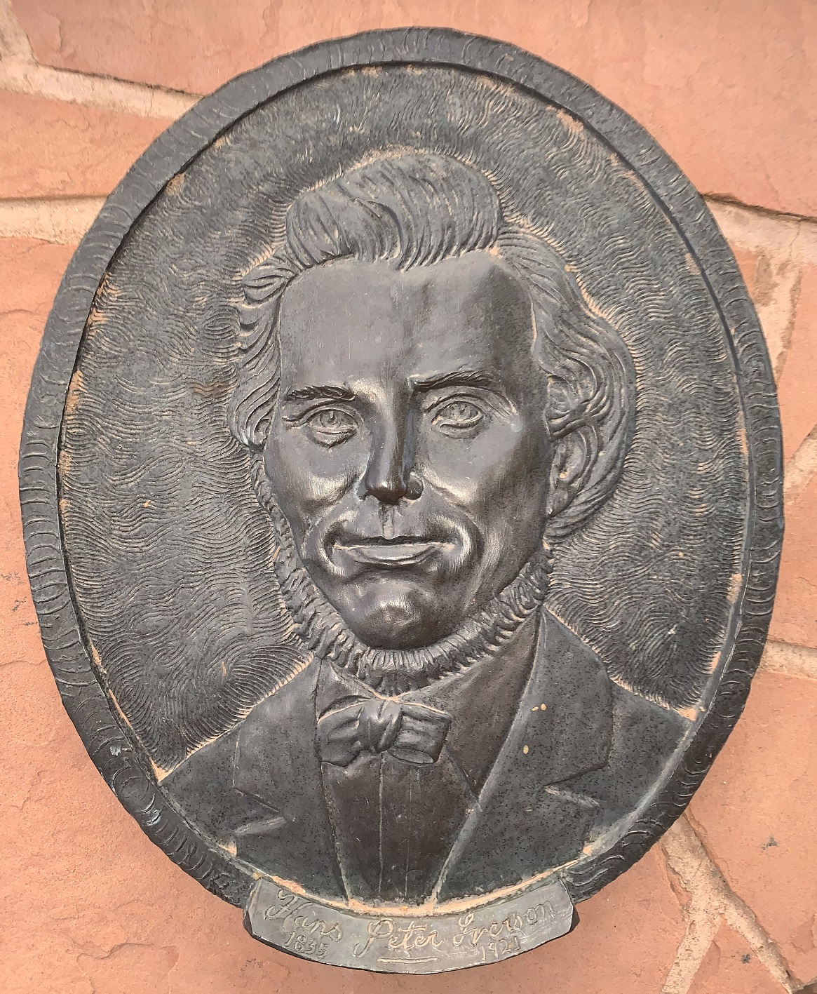 Face plaque of Hans Peter Iverson at the Monument Plaza in Washington, Utah