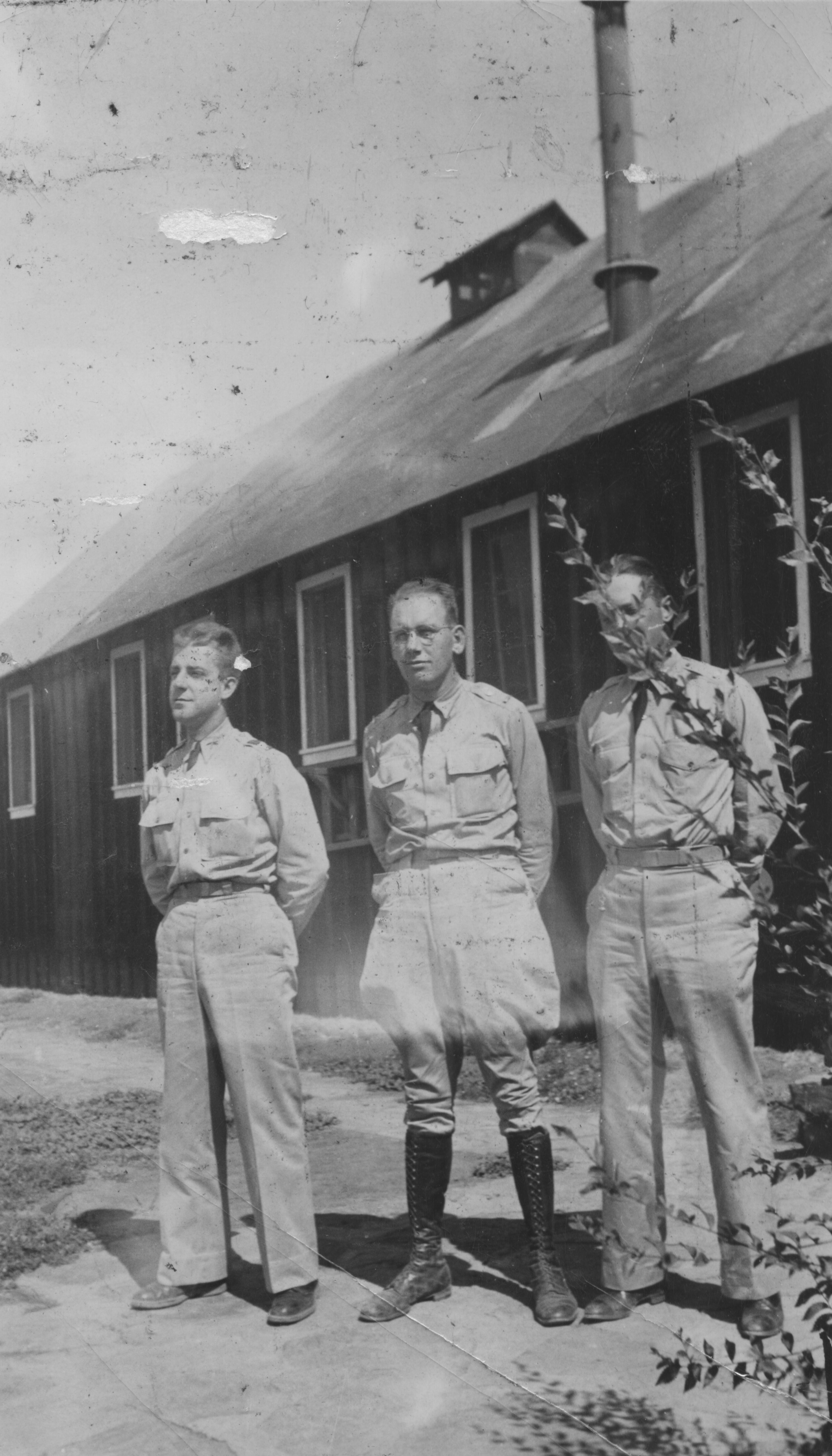 Three men in front of a building at the Leeds CCC Camp