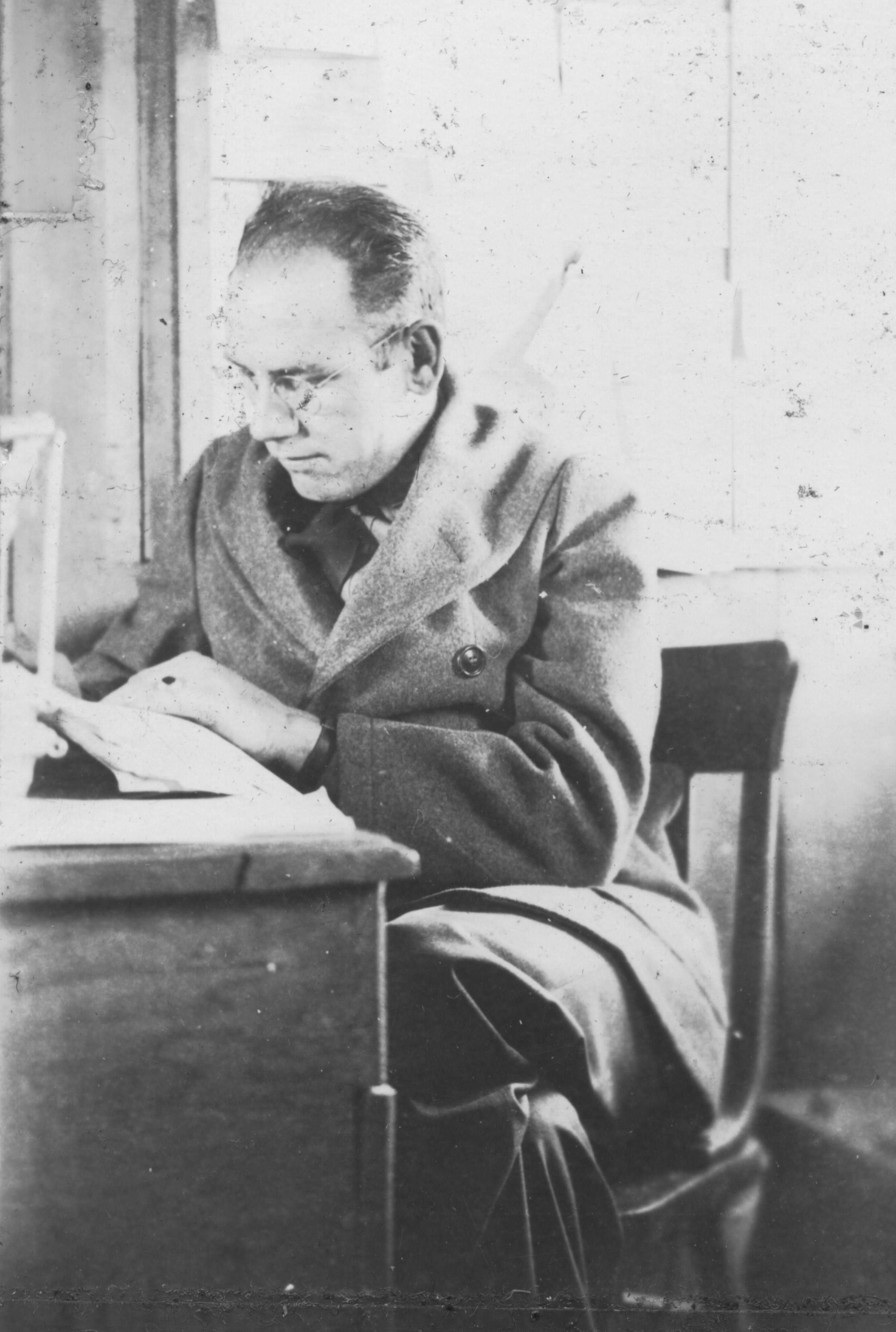 John S. Shipley working at a desk