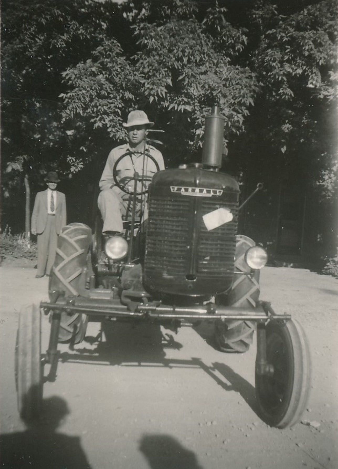 Landon Frei on a Farmall tractor