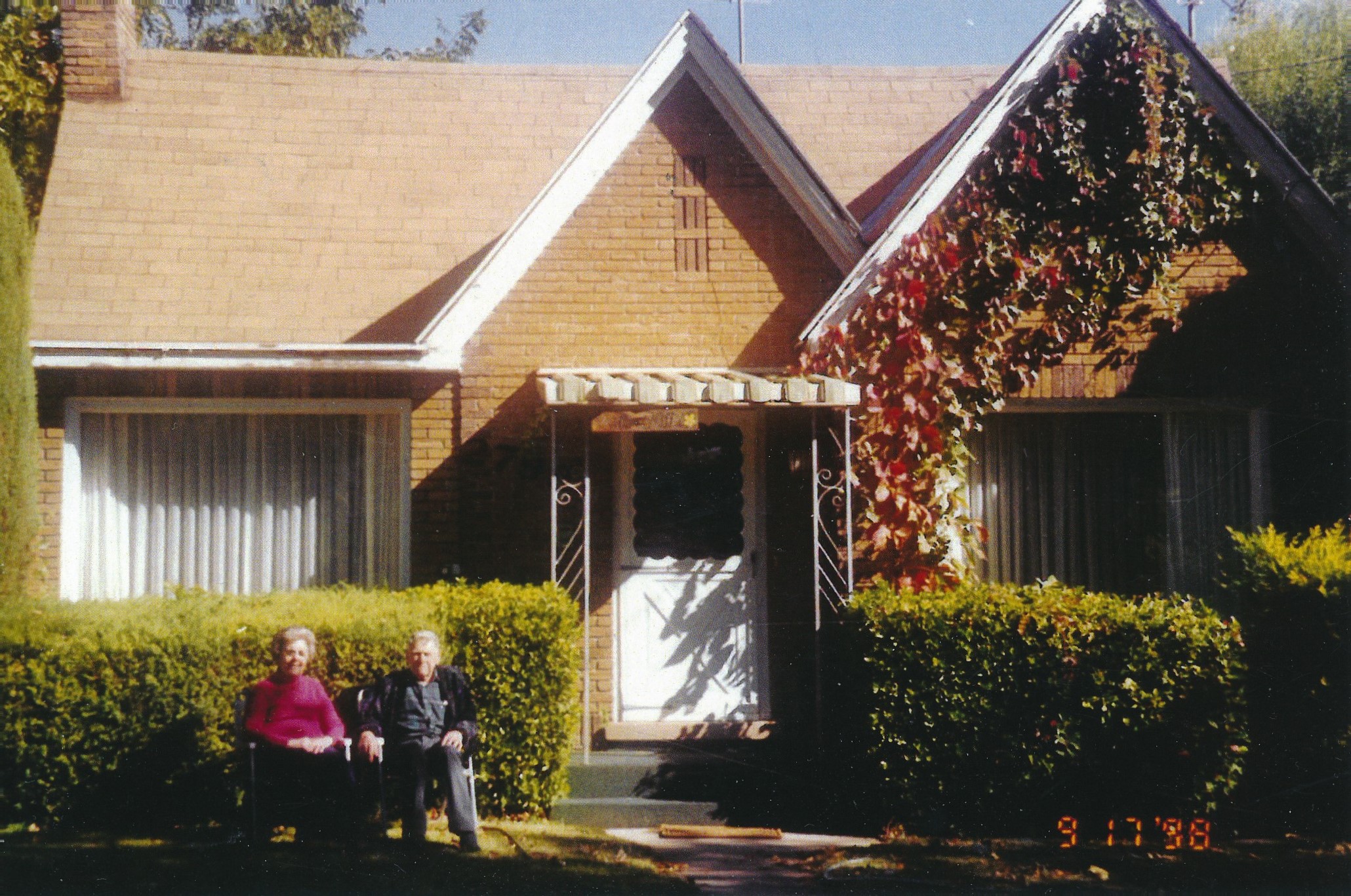 Elgin & Vivian Graff in front of their Santa Clara home