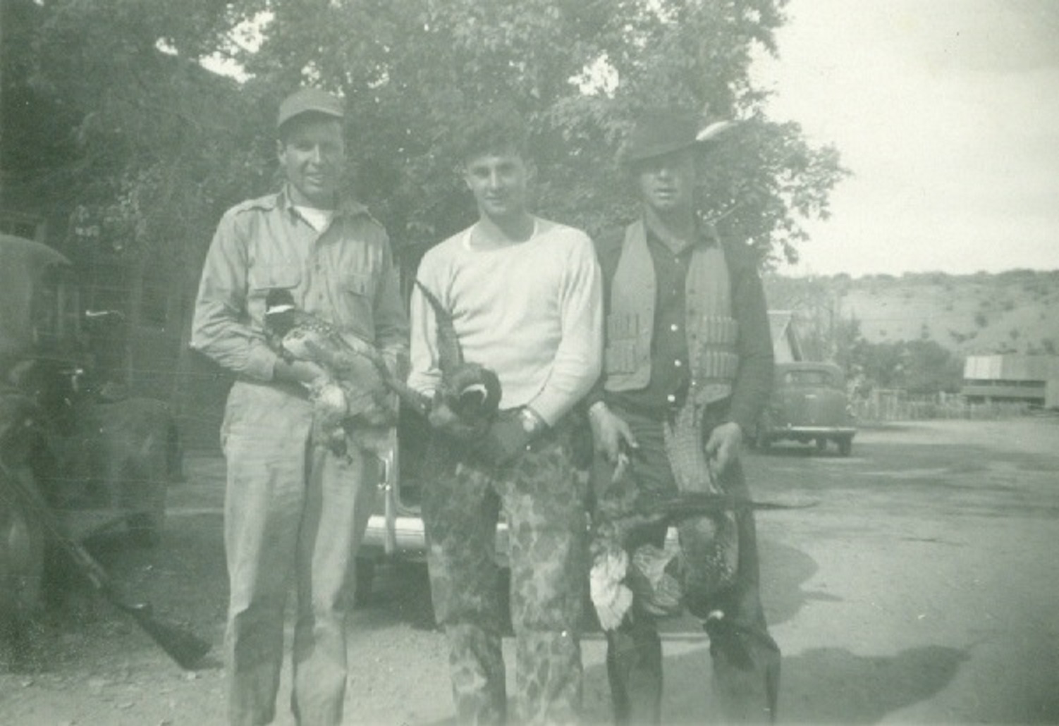 Arlo Hafen, Victor Frei, and Landon Frei after hunting pheasants