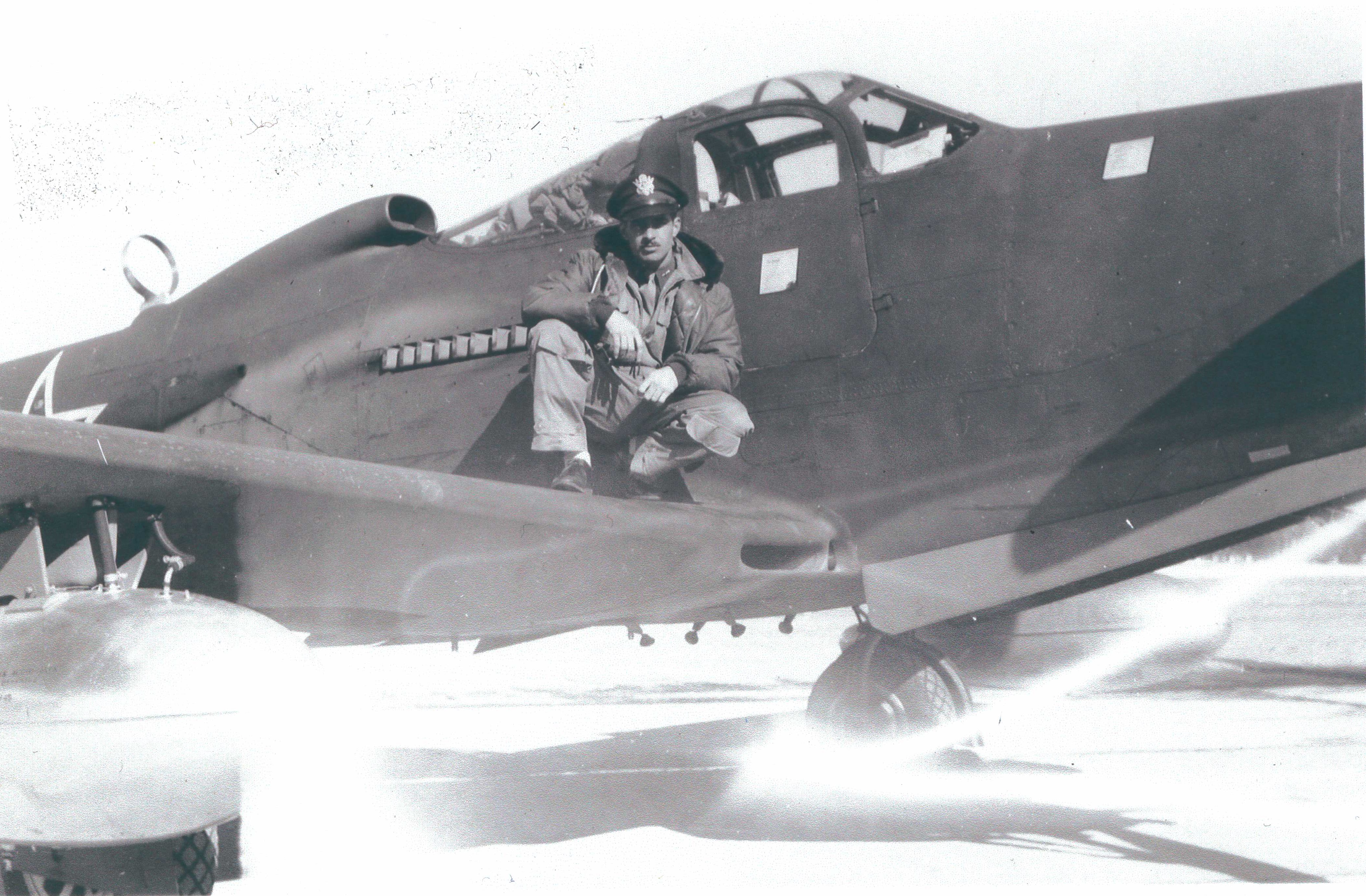 Parke Cox on the wing of a P-63 airplane